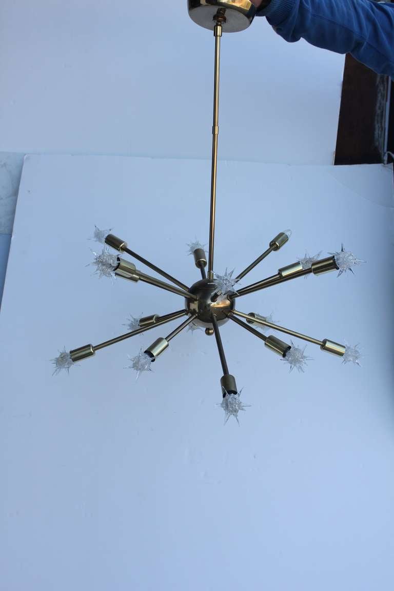 Vintage 16 light brass sputnik chandelier. In working condition.