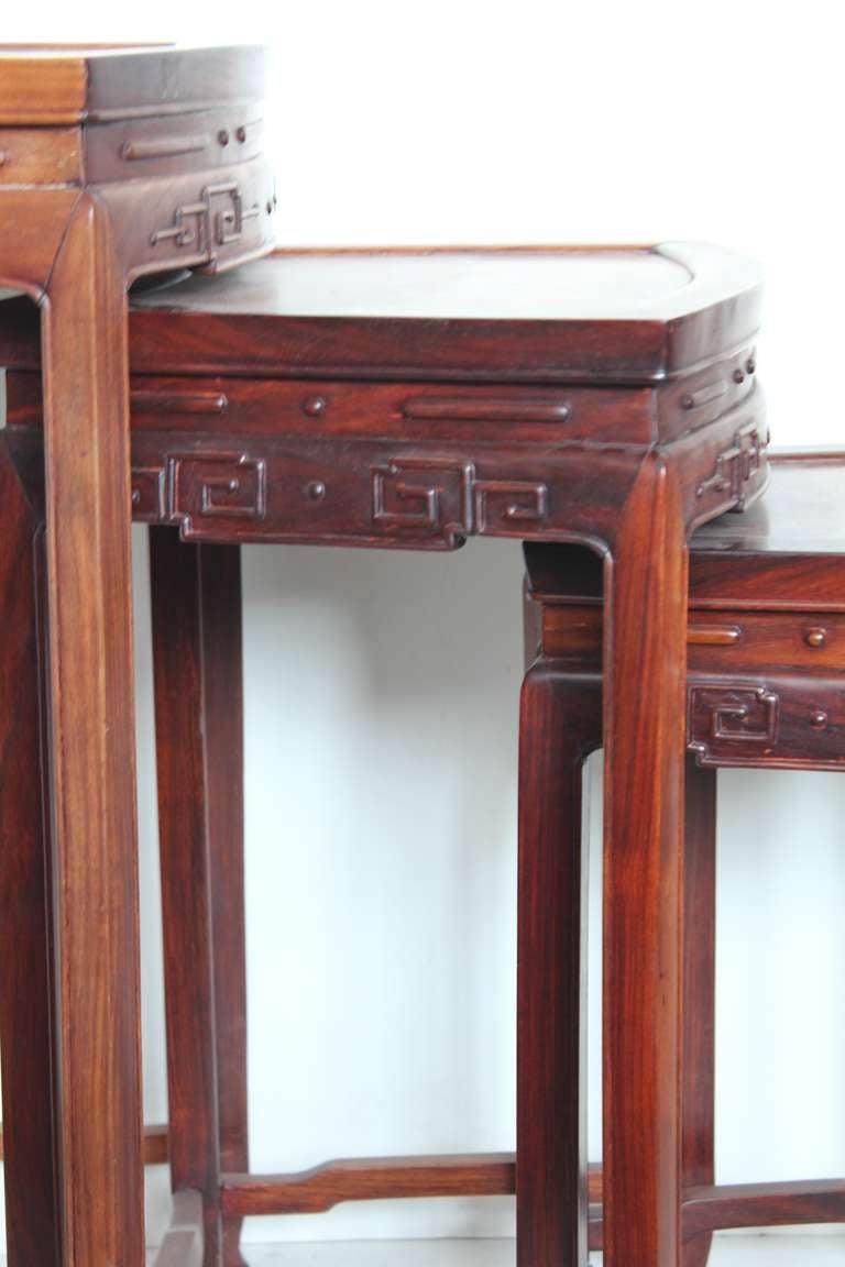 Elegant mid century wooden nesting tables.