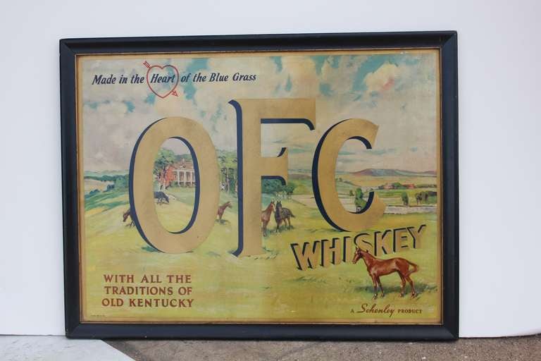Antique tin litho OFC Whiskey sign in original frame.