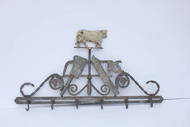 Rare antique cast iron butcher trade sign with hooks by Gloekler.