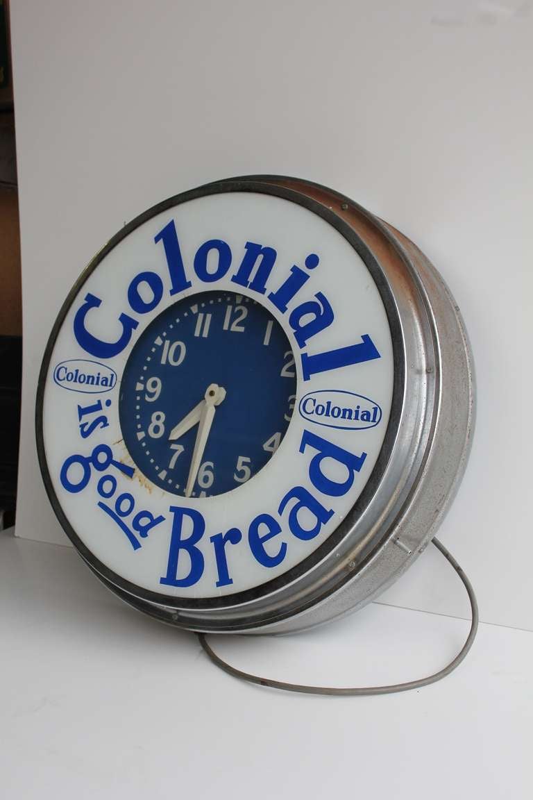 Great large 1950's green neon advertising clock for Colonial Bread.