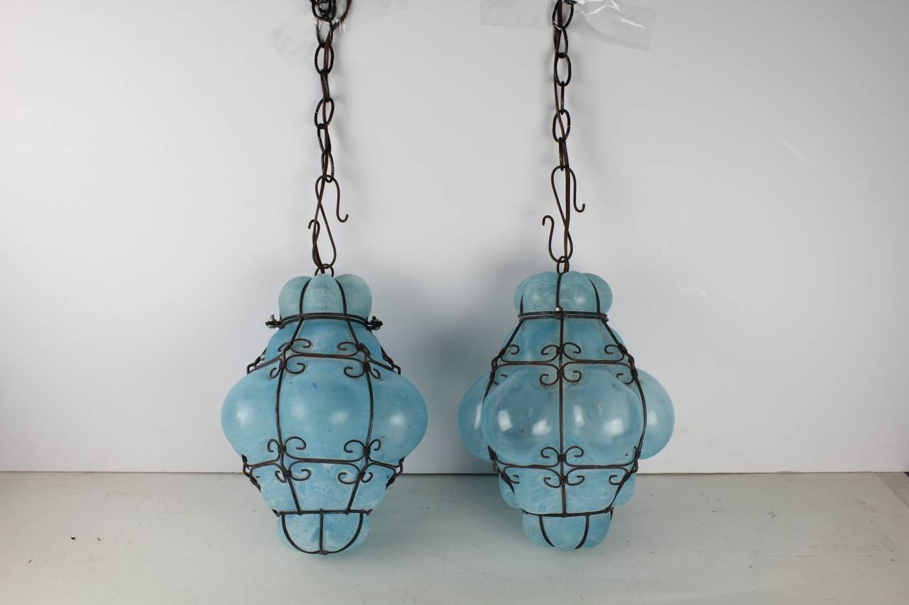 Pair of vintage Murano blue glass cage pendant lights by Seguso. H of the shade 12