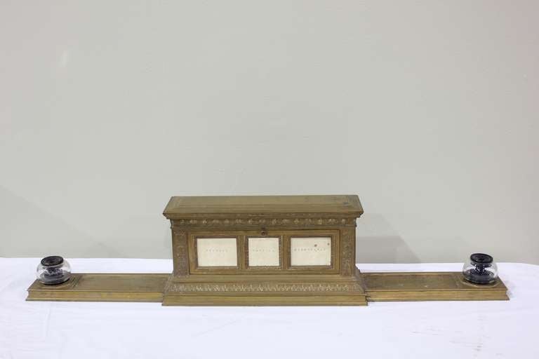 Circa 1930's ornamental brass bank desktop register pedestal with original glass inkwells.