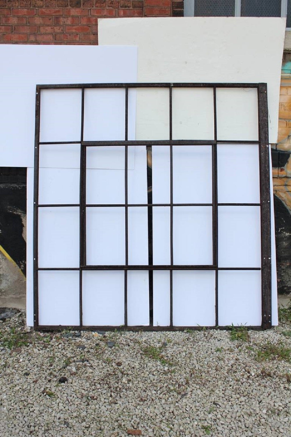Large antique industrial metal casement window. This piece doesn't include glass.