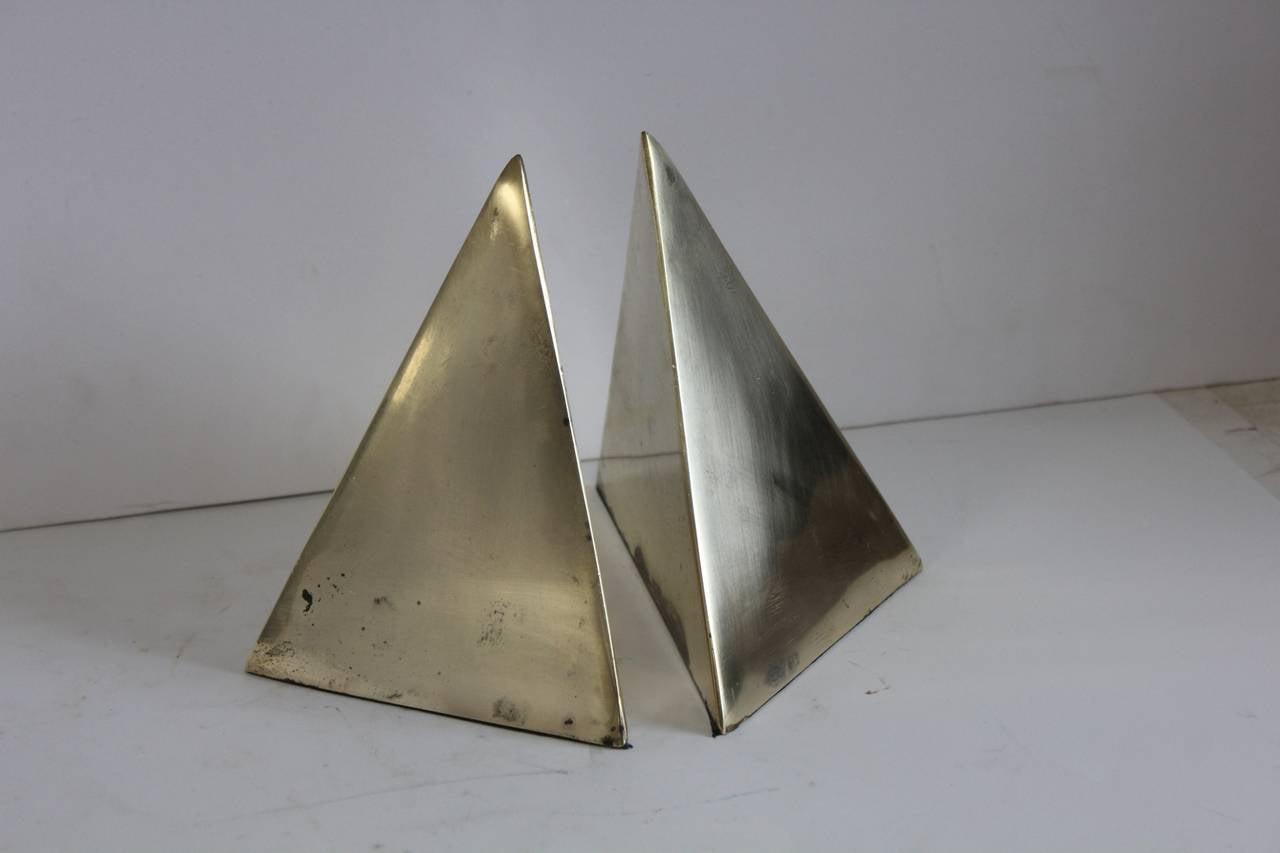 Stylish Mid-Century brass pyramid bookends.