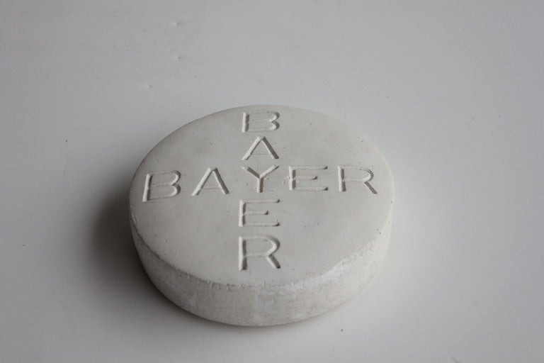 Unique over sized Bayer Pill advertising paperweight sign. Made of chalk.
