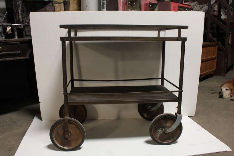 Vintage original American industrial metal cart on coasters. Great used a tea/bar cart.