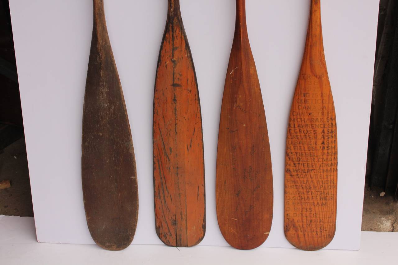 Collection of vintage wooden oars.