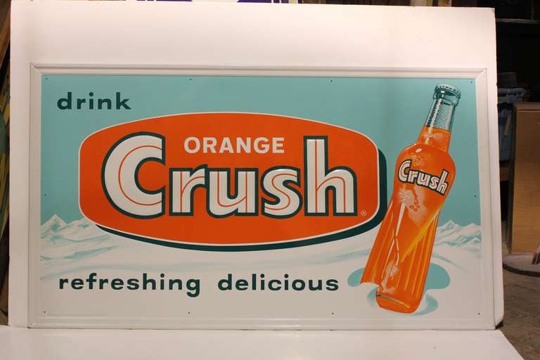 Original American 1950's embossed metal advertising sign for Orange Crush.