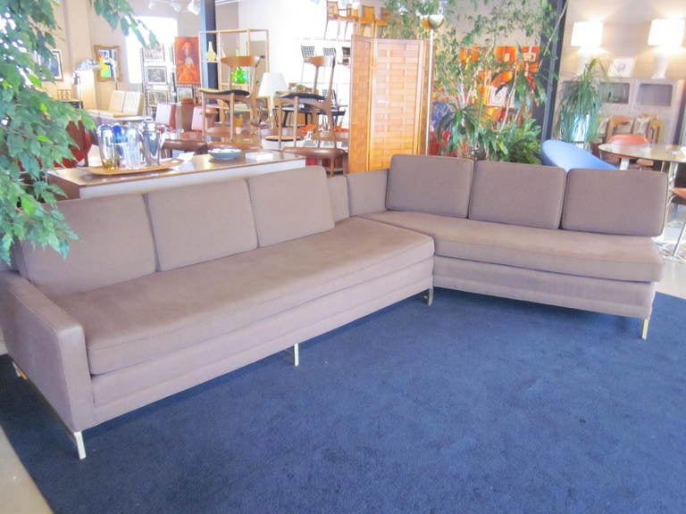 A hard to find two piece McCobb sofa set from the Metric Group with brass legs and base consisting of # 8018 Room divider sofa and # 8026 left arm tuxedo arm sofa and six pillows. Mfg. Directional Furniture Company.