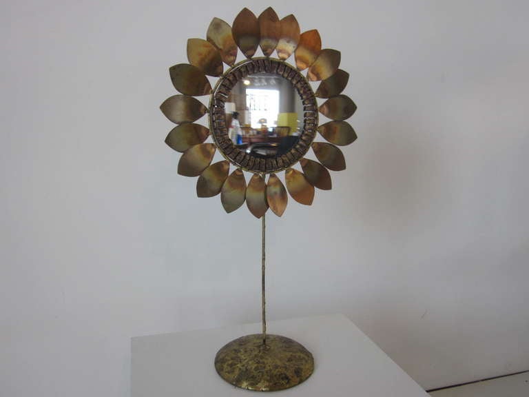A Jere table top Sunflower mirror in the Brutalist style with great detail to the metal work and drippy bronze affect to the base ,retains the designers signature. A very rare and hard to find object from Curtis Jere's sculptural collection.