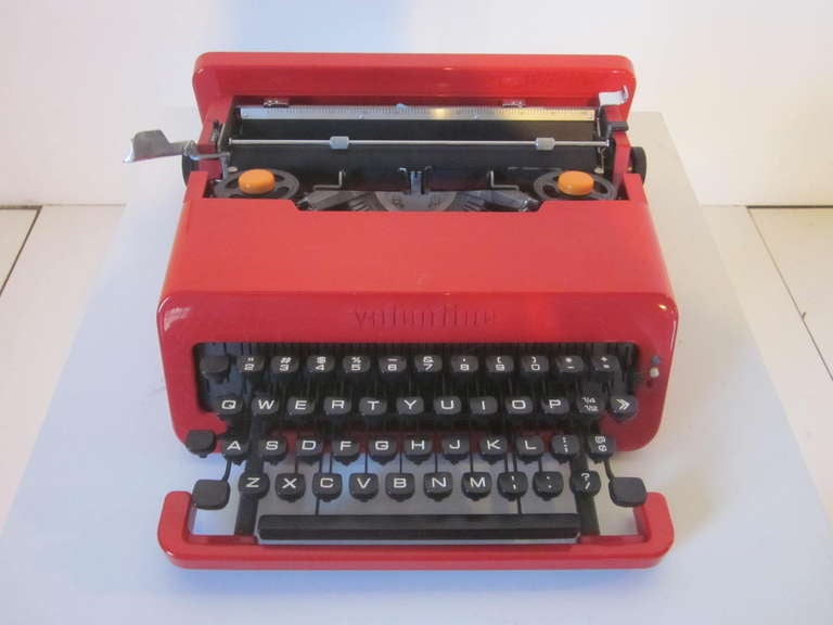 A design icon, the Valentine bright red typewriter turned the mundane office object into a work of art, made in Italy by machine manufacturer Olivetti.With a storage case and build in handle to match the typewriter, it could be slipped in and out