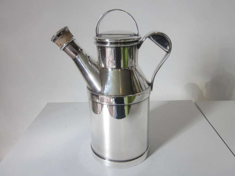 A silver plated Milk Pail cocktail shaker with handle, corked pour spout and lid, a 64 OZ size, manufactured by the Reed & Barton company.