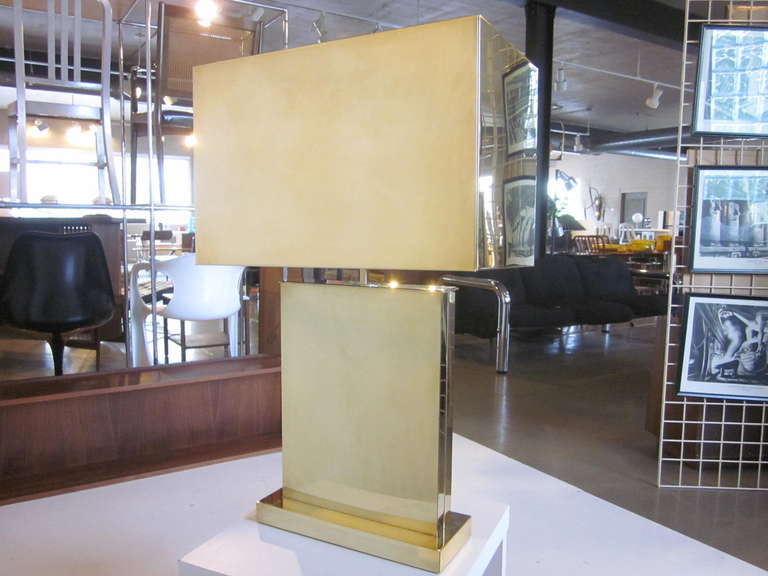 A brass Jere table lamp with large box shade and matching base, signature to the back lower area.