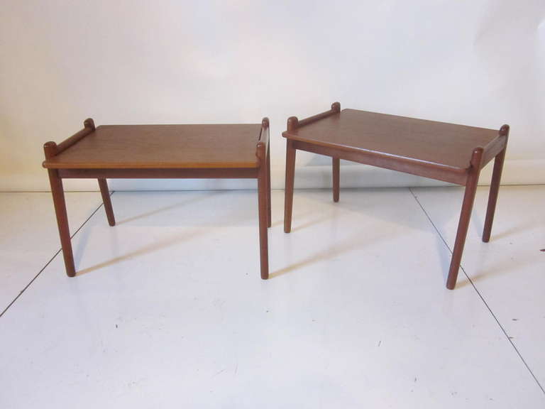 A pair of teak wood side tables with reversible tops and matching legs , excellent light styling and the tables can be taken completely a part in a matter of minutes. Retains tags of manufacture Vatine Lenestolfabrikk, Norway