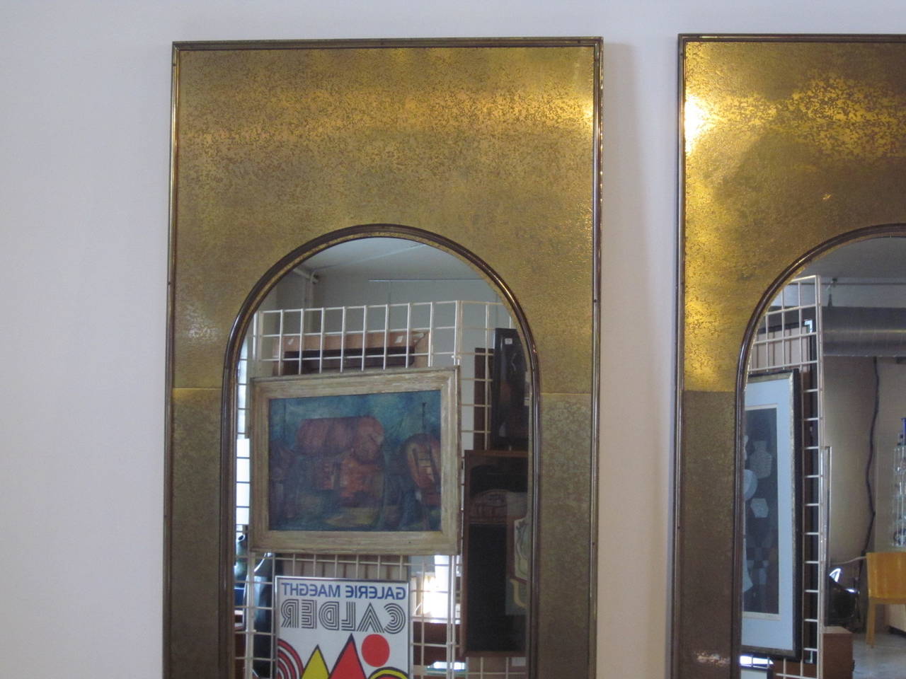 Acid etched brass mirrors with brass frame detail and cathedral cut design, wood backed, well-constructed and heavy as only Mastercraft can do them.