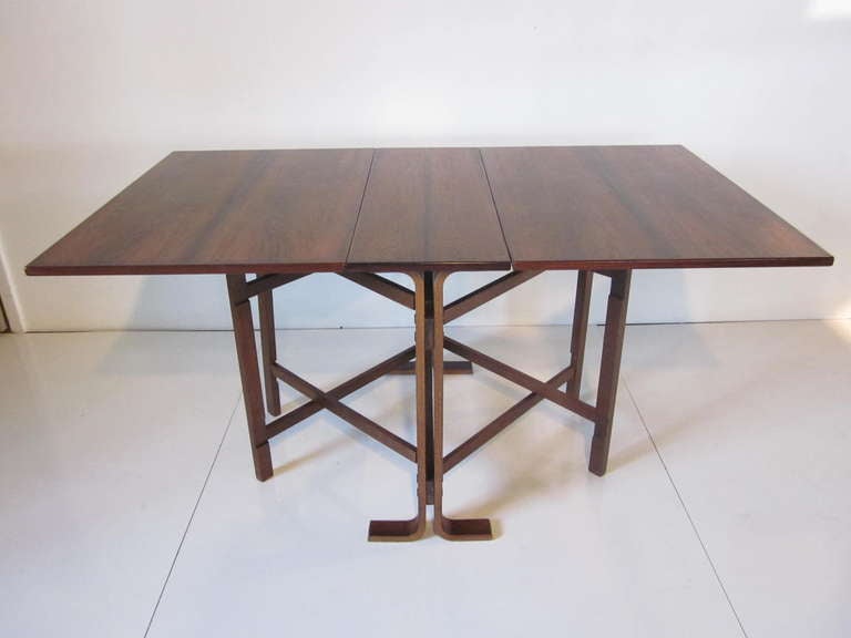 A Brazilian rose wood drop leaf gate leg table with matching bentwood main leg construction and two folding leaves the inner legs fold out to complete the base.