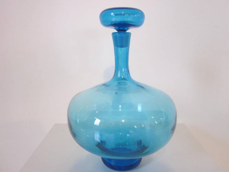 A blue handblown stoppered bottle from the iconic 1950s glass company Blenko manufactured in West Virginia. Just the right size for that touch of color in your space.