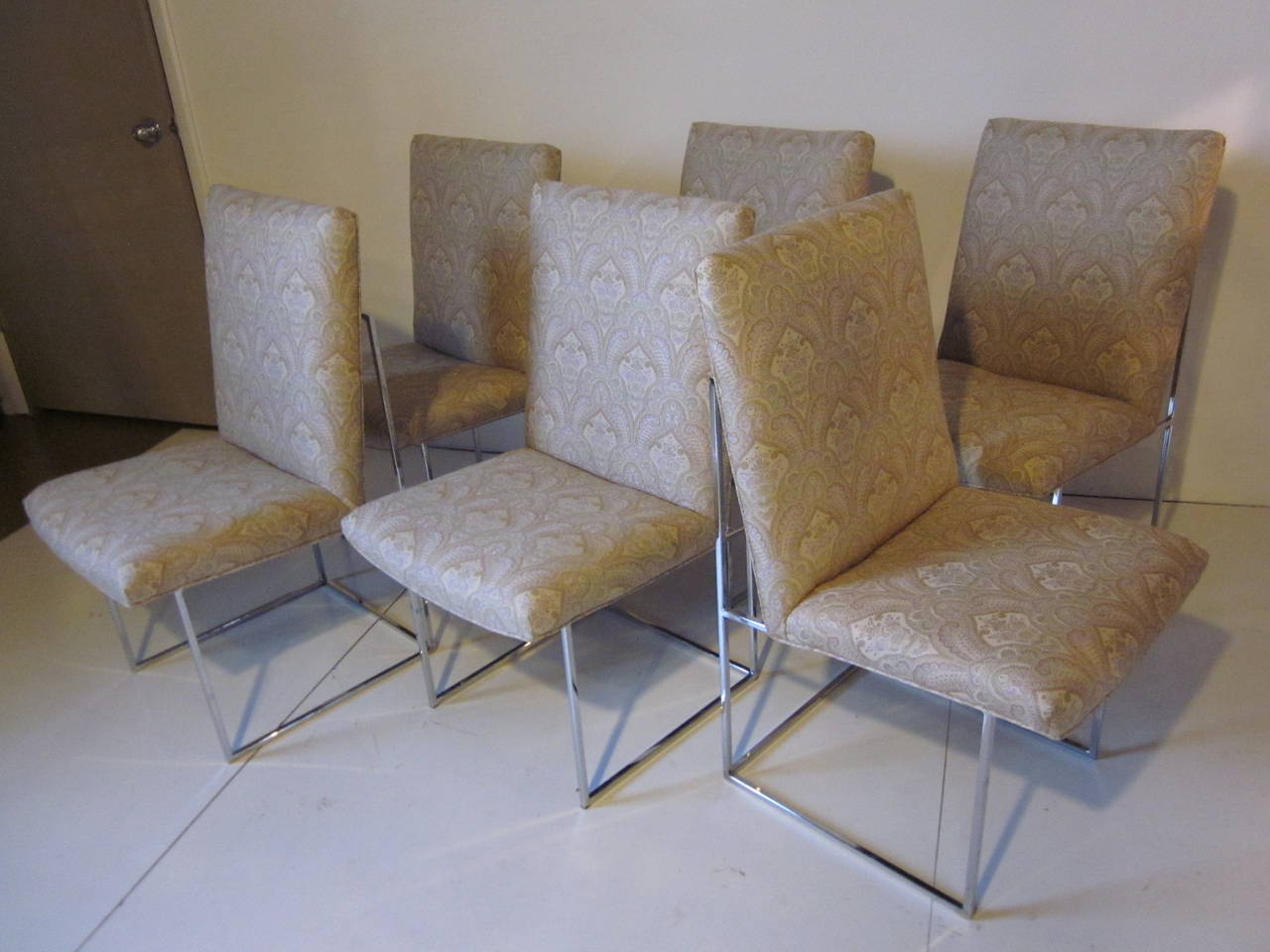A set of six Milo dining chairs with square tube chrome frames and upholstered high back seats. Refinished in a funky traditional styled pattern but with a touch of up to date colors, manufactured by the Thayer Coggin Furniture Company.
