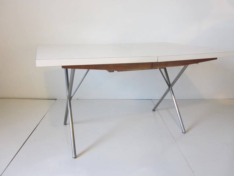 A rare and early George Nelson designed X-leg extension dining table with build in 18