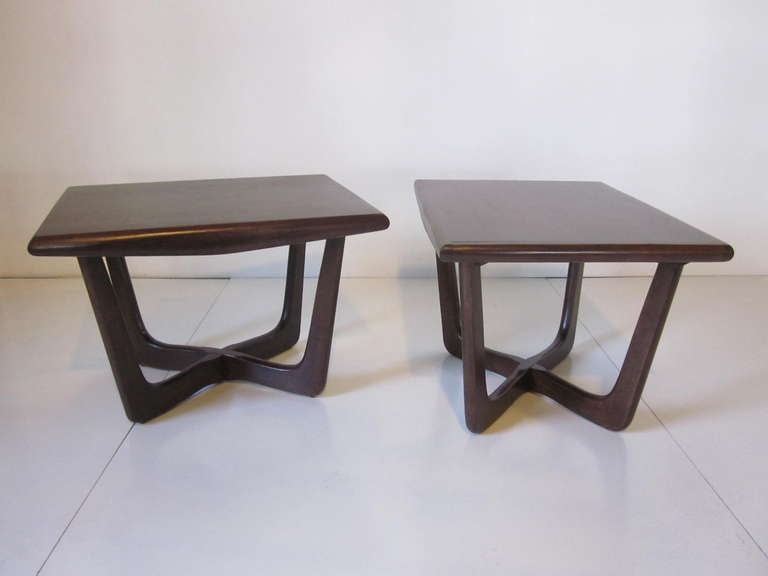 A pair of dark walnut end table with X base matching sculptural legs, manufactured in the manner of Adrian Pearsall.