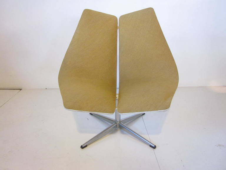 This sculptural chair was designed for the 1967 Expo in Montreal hence the name Montreal Pavilion chair with painted molded plywood frame, Maharam Danish wool fabric cushion sitting on a chrome metal swivel base. Retains all tags, manufactured by