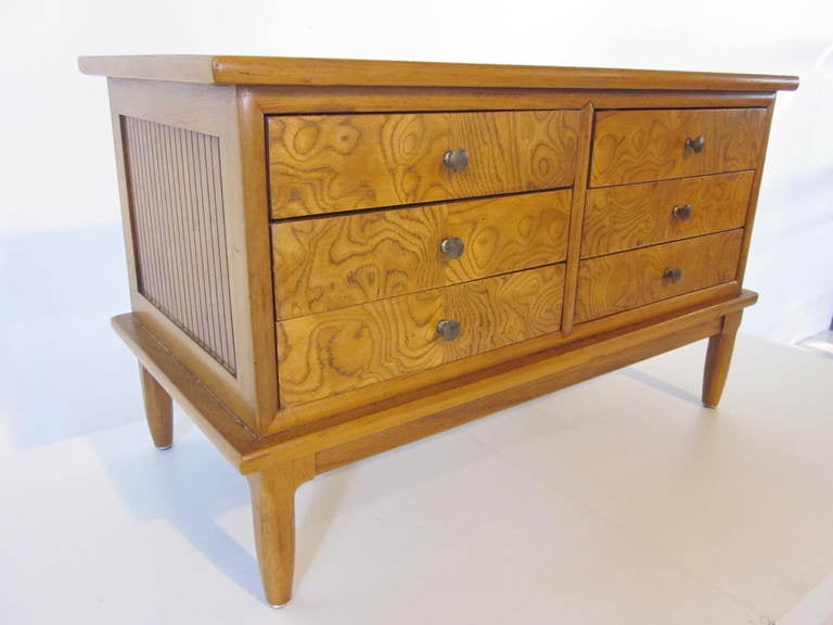 A miniature credenza jewelry box with six burlwood felt bottomed drawers ,bronze pulls and handcrafted detailed box.Retains decal to drawer Mfg. by Tomlinson for their Sophisticate Line. 