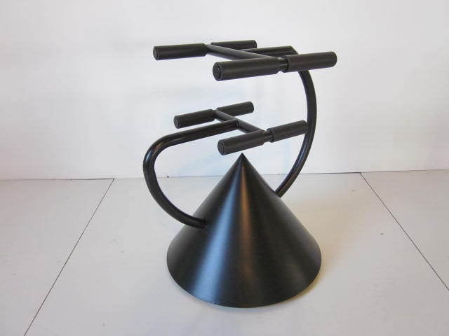 A Ron Arad TV,DVD and cable box stand in black enameled steel and rubber made for the Zeus Hotel,United Kingdom,Zeus Noto made in Italy.