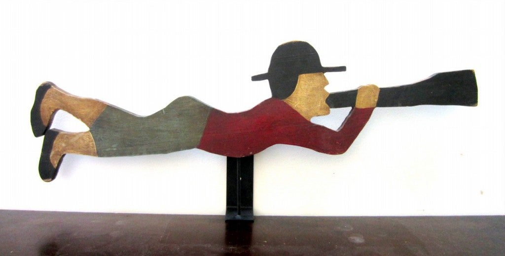 PINE, ORIGINAL PAINT, EXCELLENT CONDITION, SUPERB PATINA<br />
<br />
Classic Cape Cod, MA whaler weathervane, depicted blowing his horn, indicating sighting of a whale.  Cut from a single pine board, complete will museum wall mount, as shown. 
