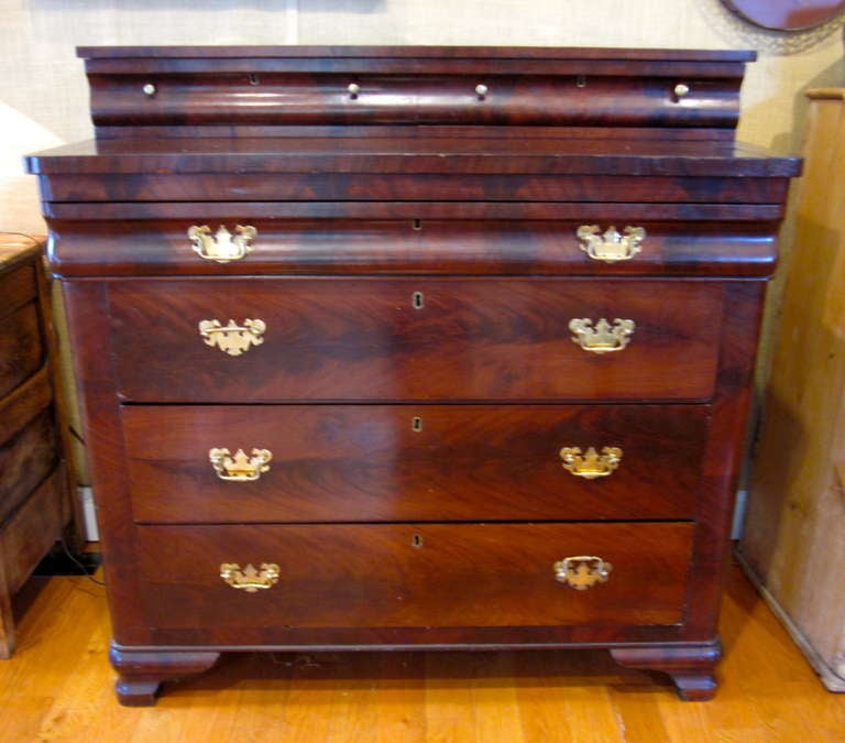 Mahogany empire stepped back dresser with 4 lower drawers and 2 upper.