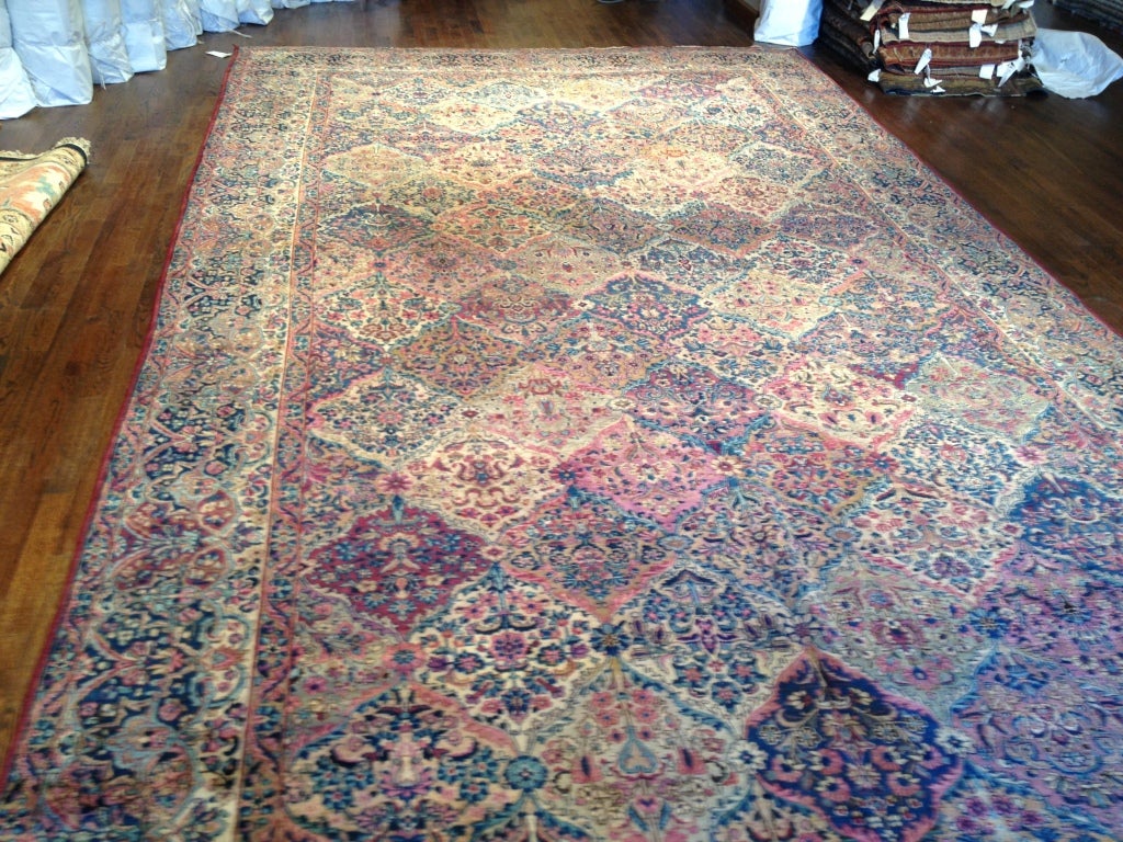 Antique Lavar Kerman wool pile rug.  Colors of rose/pink/blue/ivy