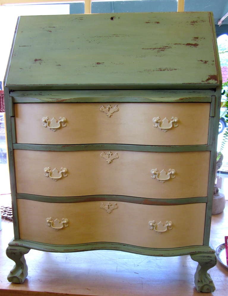 Serpentine front painted Chippendale style mahogany desk. Three large drawers and 3 small interior drawers and cubbies. Depth measures 28.5 when top is open.