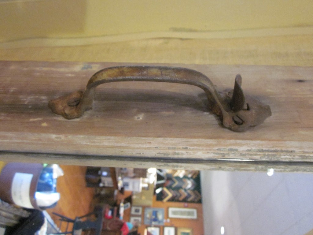 Antique door from a Connecticut farmhouse has mirrored panel behind the window grid. Original rusted hardware still attached.  Can be hung or leaned against the wall. Great as a hall mirror or decorative accent.