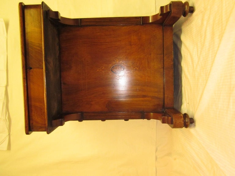 English Walnut Davenport / Writing Desk ca 1860
This exquisite  Victorian davenport  writing desk has a lift up writing slope with a  newly restored  tooled leather  insert and boxwood, ebony and satinwood banding.
The interior has four small