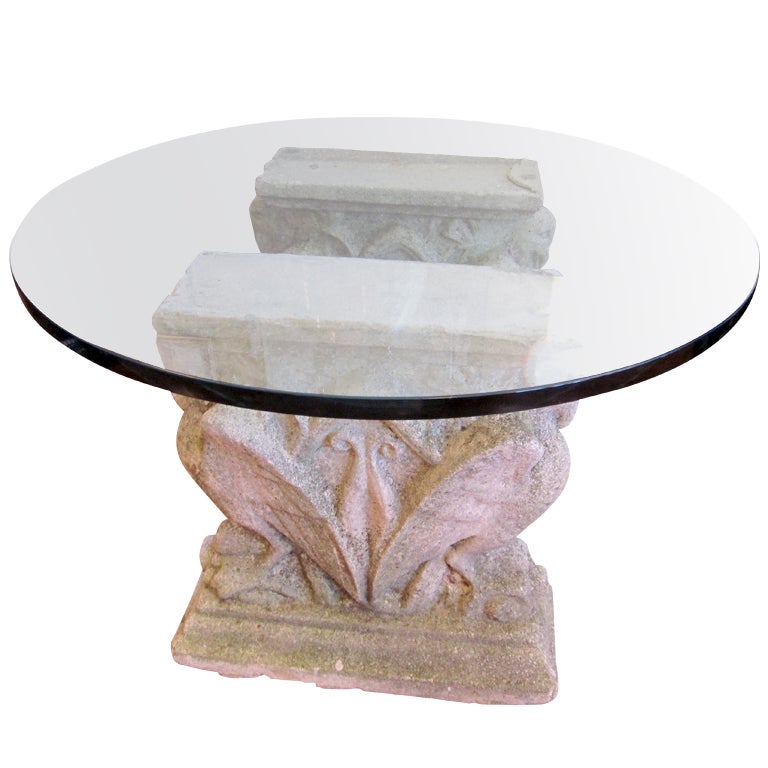 Glass top coffee table with antique cement pedestals base For Sale