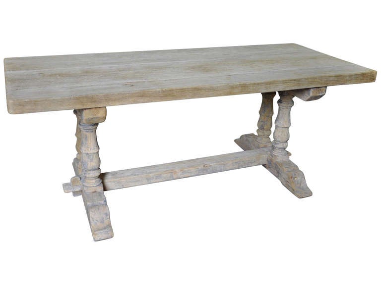 French farm table in washed oak from the mid 20th century. This beautiful table adds substance and style to any room. Use it as a kitchen table, dining table, conference table, or desk.