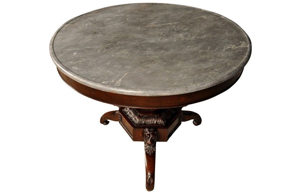 This antique English round table has the original marble top. This piece would make a beautiful foyer table, or would be great as a side table, end table, or accent table.