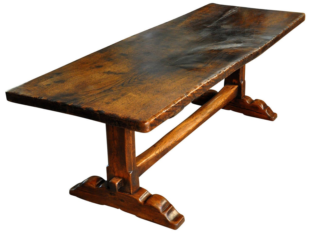 A very handsome 19th century French Farm Table - Trestle Table in chestnut.  The top is a solid board.  This wonderful table has a very deep and rich patina.  Wonderful not only as a dining table, but as a writing table or sofa table as well.