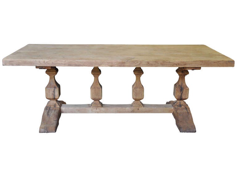 French antique monastery trestle table from the early 20th century in oak. This beautiful farm table has clean lines and a great scale. It would be great to use as a partner's desk or as a kitchen table.