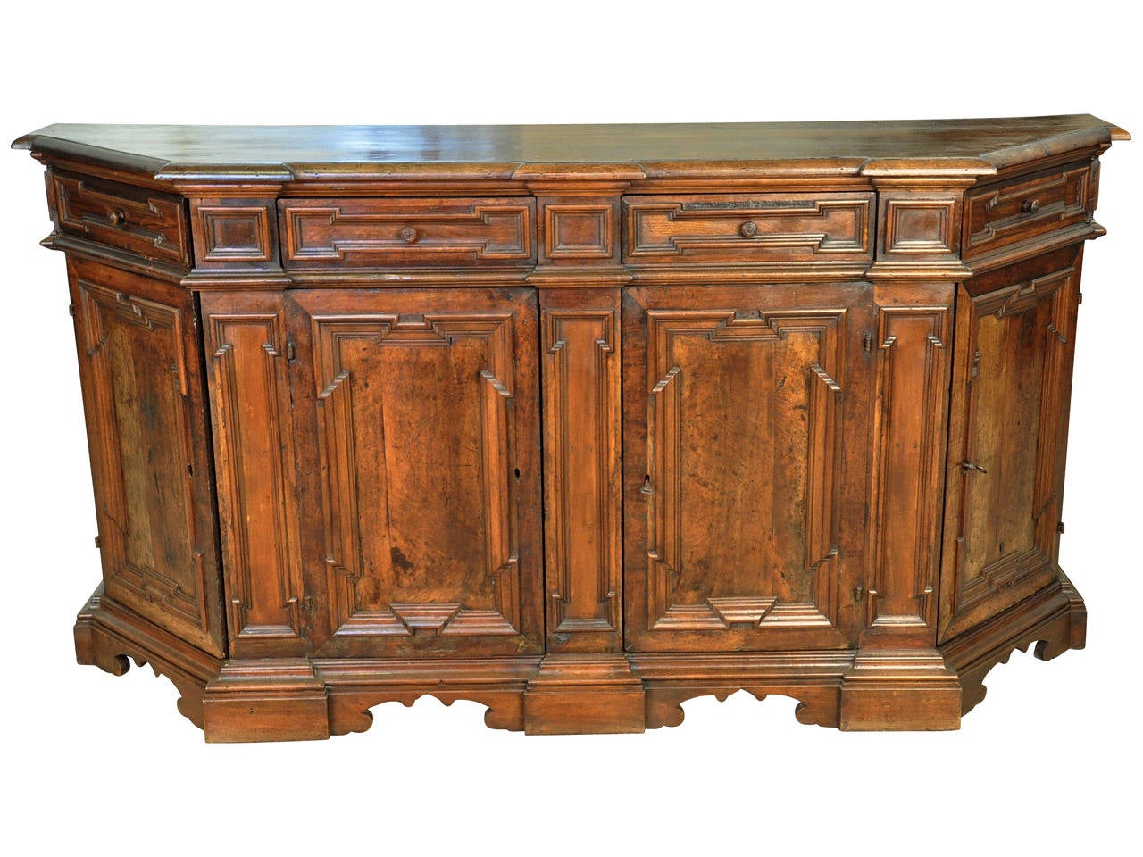 A very handsome 19th century solid walnut Credenza from the north of Italy.  Beautifully finished with molded door and drawer panels - raised on sculpted bracket feet.