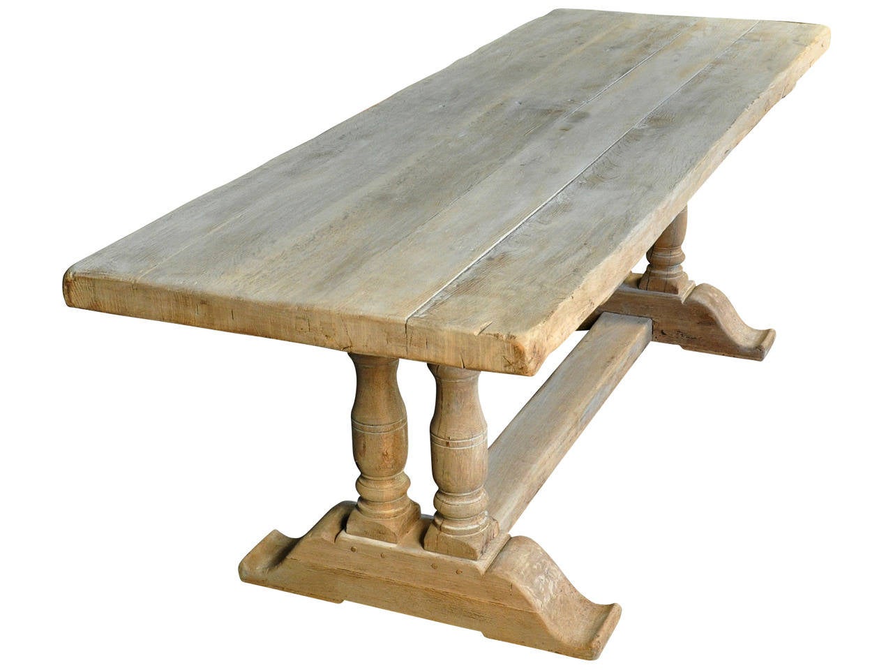 French 19th century farm table - trestle table soundly constructed in bleached oak.  Wonderful not only as a dining table, but would serve beautifully as a large sofa or console table as well.