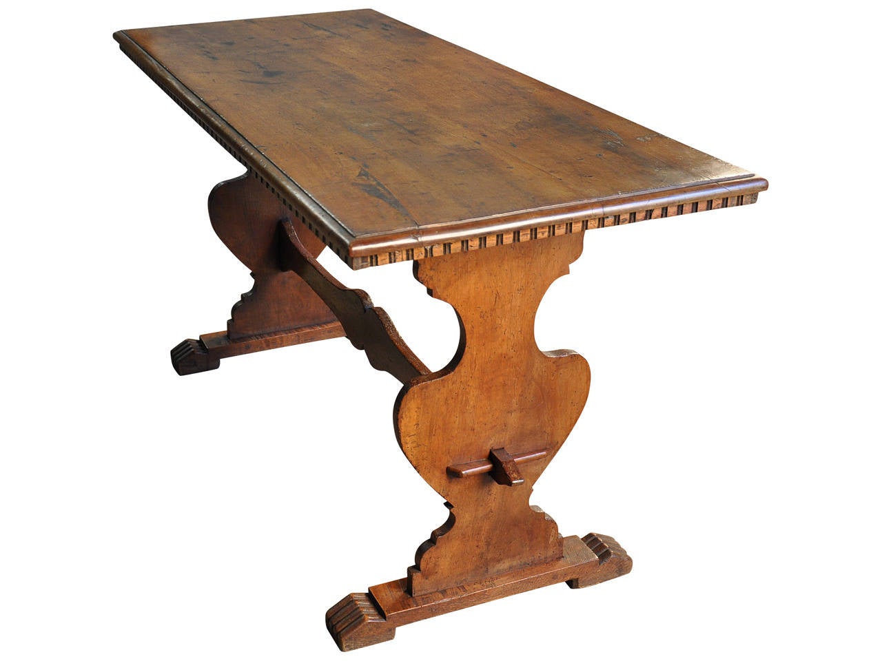 A very handsome late 18th century Italian trestle table/console in walnut.  This charming table's diminutive size lends this table to serve as an excellent writing desk, sofa table or small scale breakfast table.  It is beautifully constructed and