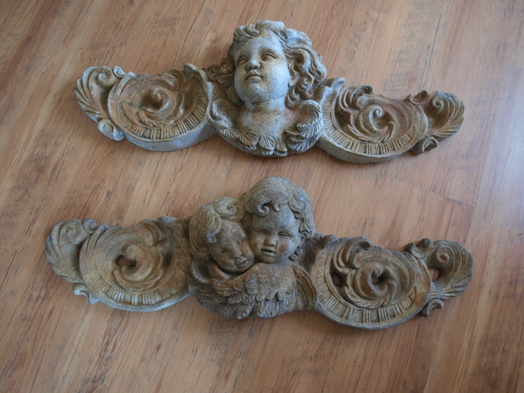 Pair of Mid 20th Century Concrete Angel Architectural Ornaments.
Beautiful patina and detail on these wall mounted angel ornaments. They would look beautiful in a garden courtyard peeking out from an ivy covered wall. Priced for the