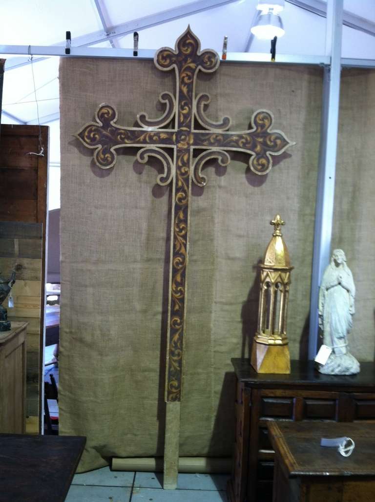 Antique Spanish cross in painted wood from the mid 19th century. This exceptionally large and beautiful cross was from a chapel in Barcelona. This piece is sure to add drama and a sense of stately elegance to any space.