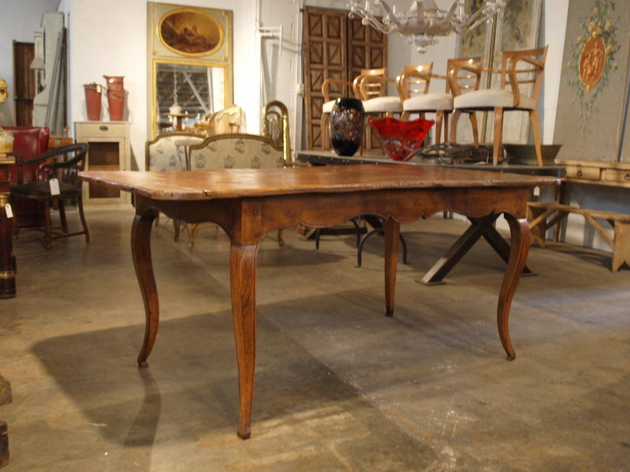 18th Century French Provencal Dining Table in chestnut from the Saint Remy De Provenance area.  This very lovely table is full of character and charm.  The patina is deep and very luminous - with wonderful grain patterns.  The beautifully sculpted