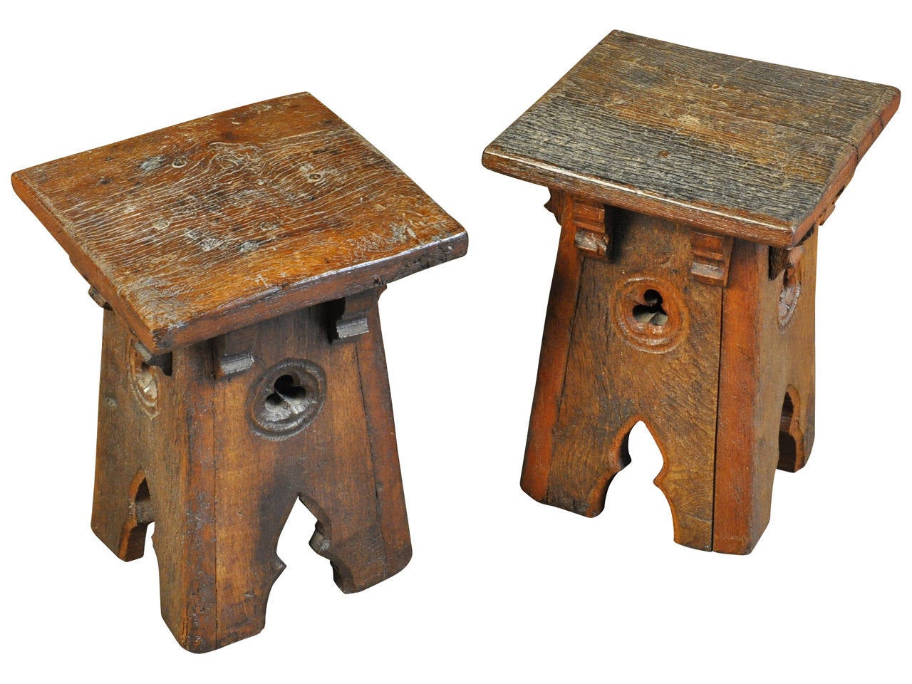 19th century French Provencal stools in the gothic style constructed from darkly stained oak.  Wonderful not only as stools but serve nicely as smaller pedestals or plant stands.  The price listed is for a pair.  There are a total of three stools. 