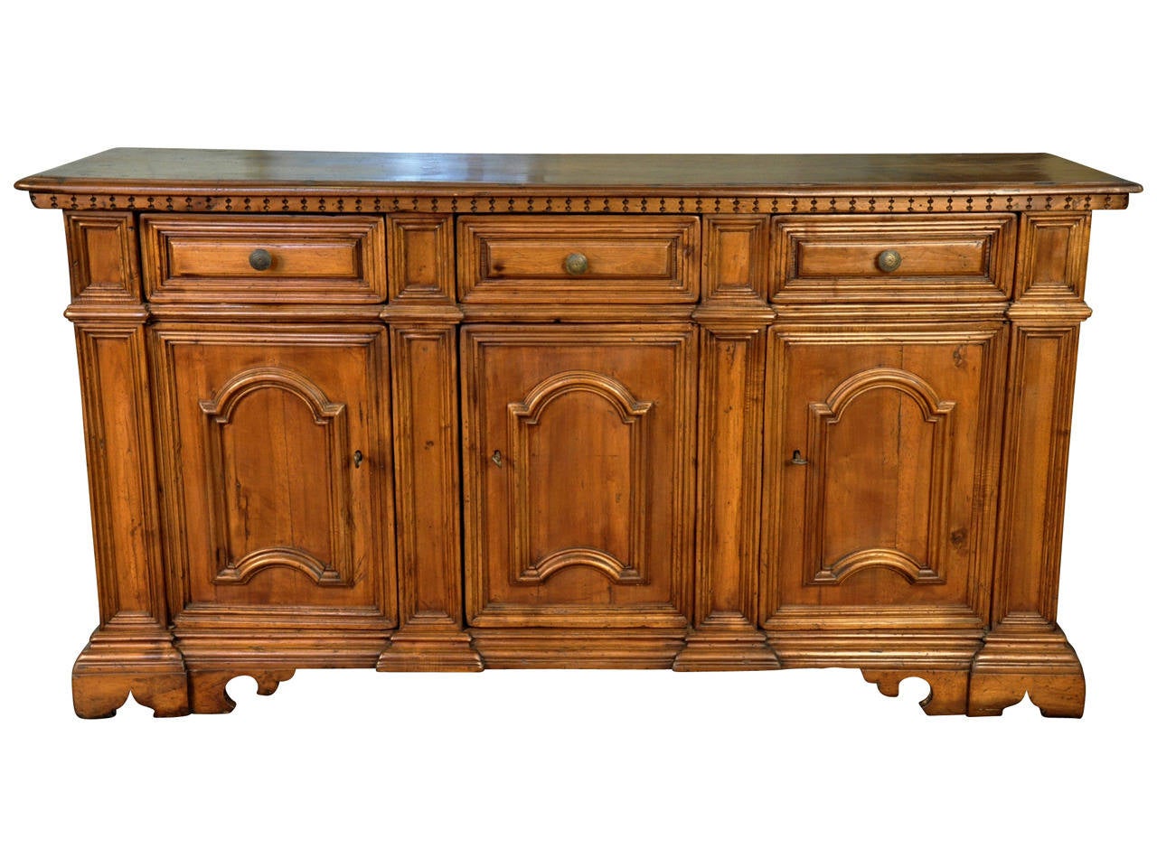 A very handsome late 19th century Credenza in walnut from Northern Italy, circa 1880.  Beautifully constructed with molded panels throughout, dentilated detail to top surface, three drawers and three doors.  A wonderful storage pieces that will
