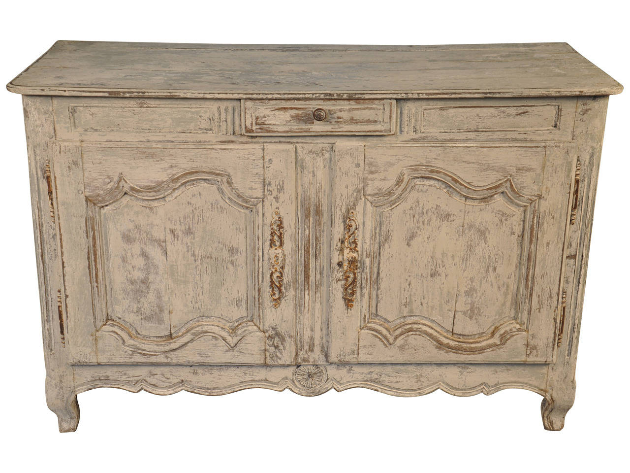 A lovely 18th century French Provencal 2 door buffet in painted wood.  This charming piece is simply adorned with molded door panels and has a single drawer.  The finish is in hues of off-white.