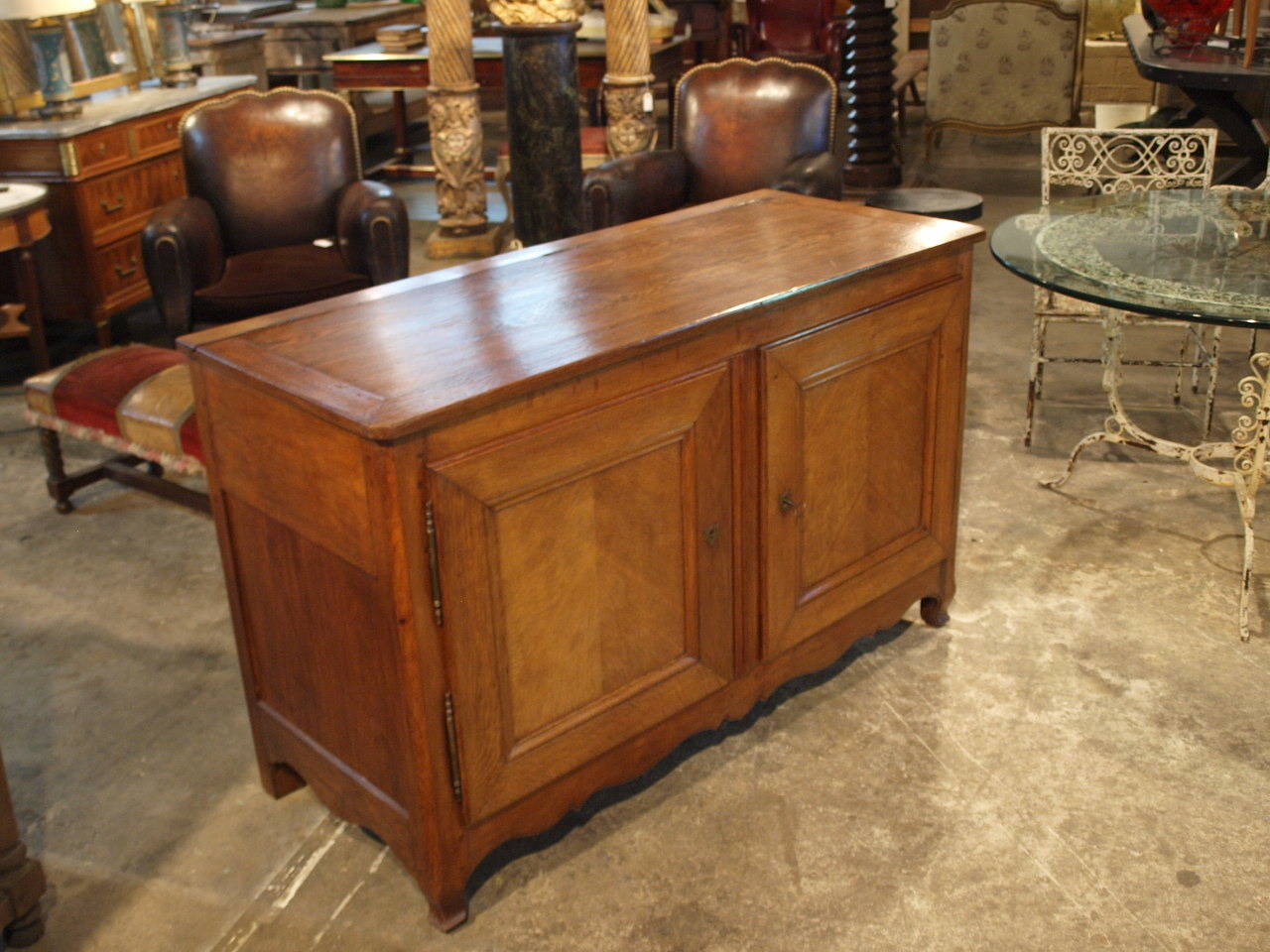 A very handsome mid-19th century French Provençal two door buffet with lifting top.  A wonderful storage piece constructed from stained oak.  The luminous patina gives this piece so much added charm.