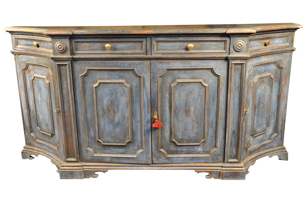 A very handsome late 19th century Italian credenza in painted wood.  An excellent buffet piece offering very good storage with four doors and four drawers.